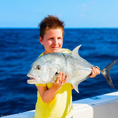Steady Pressure Maui Kid Holding Fish